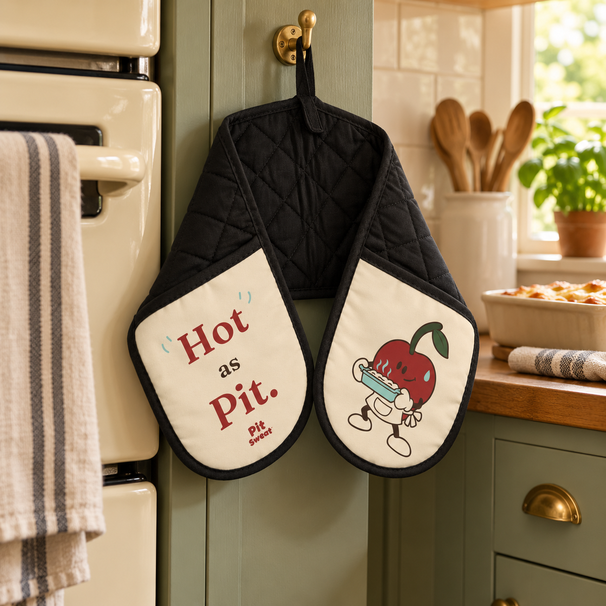 Hot as Pit. Double Oven Glove — hanging in a warm kitchen