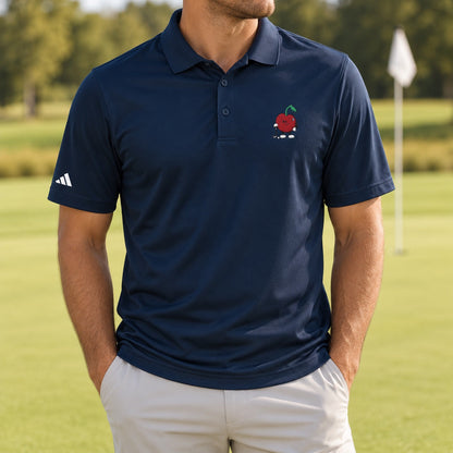 Navy adidas polo with golfing Pit chest embroidery on a putting green