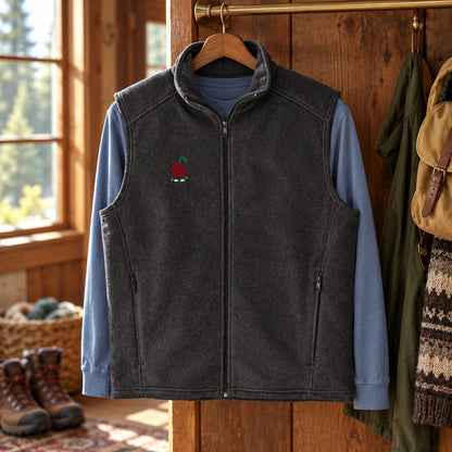 Charcoal Little Pit fleece vest layered over a blue shirt on a cabin coat rail